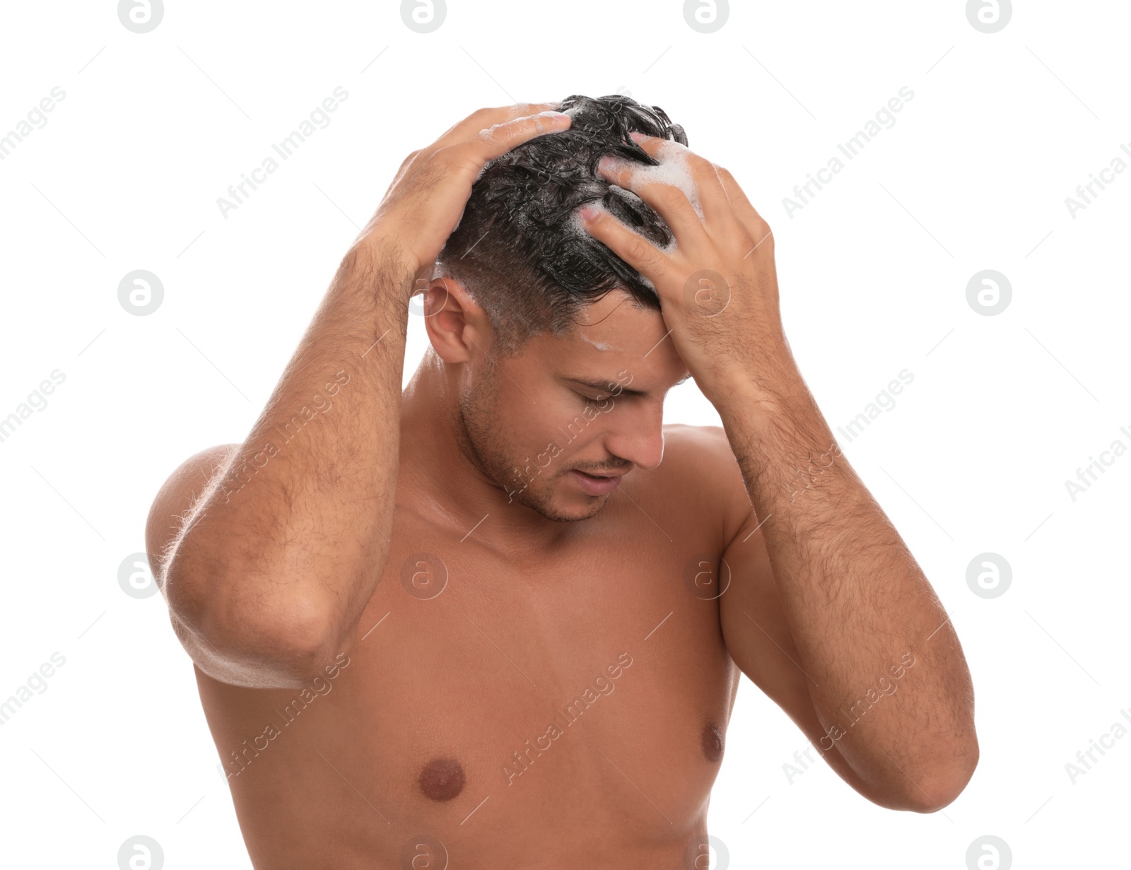 Photo of Handsome man washing hair on white background