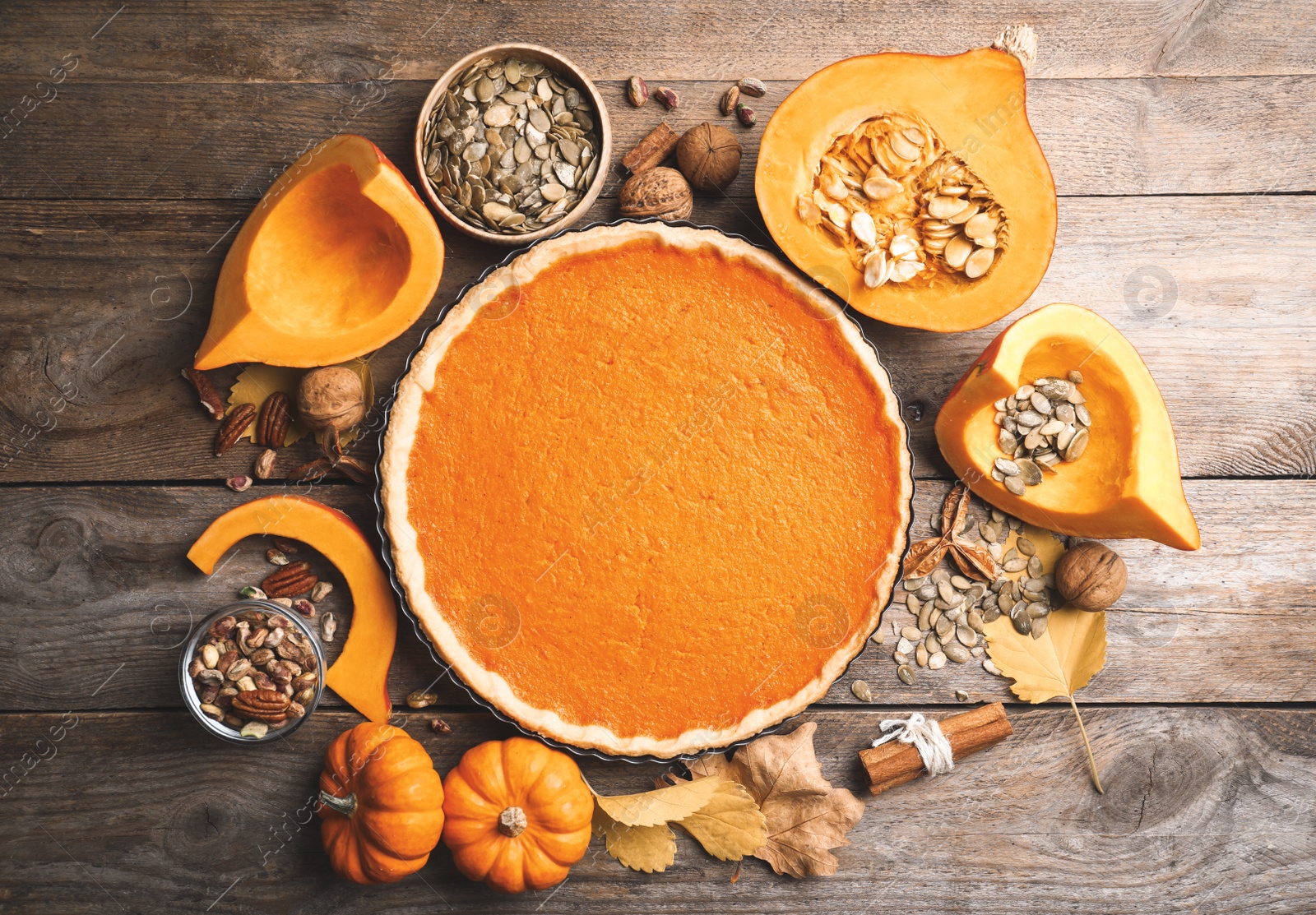 Photo of Flat lay composition with delicious homemade pumpkin pie on wooden table