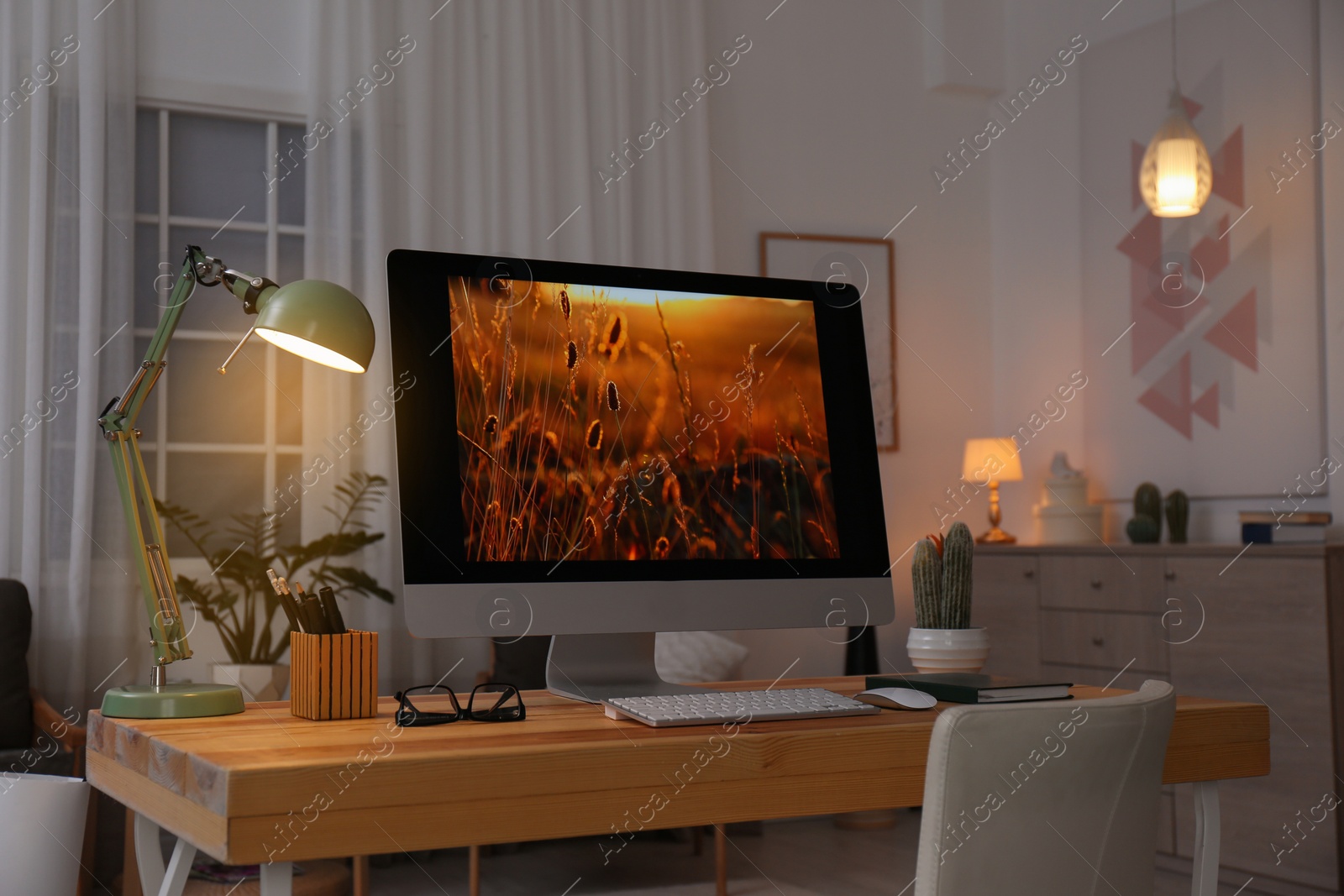 Photo of Comfortable workplace with modern computer on desk. Home office