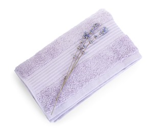 Photo of Folded violet terry towel and dry lavender isolated on white, top view