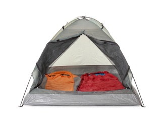 Photo of Comfortable grey camping tent with sleeping bags on white background
