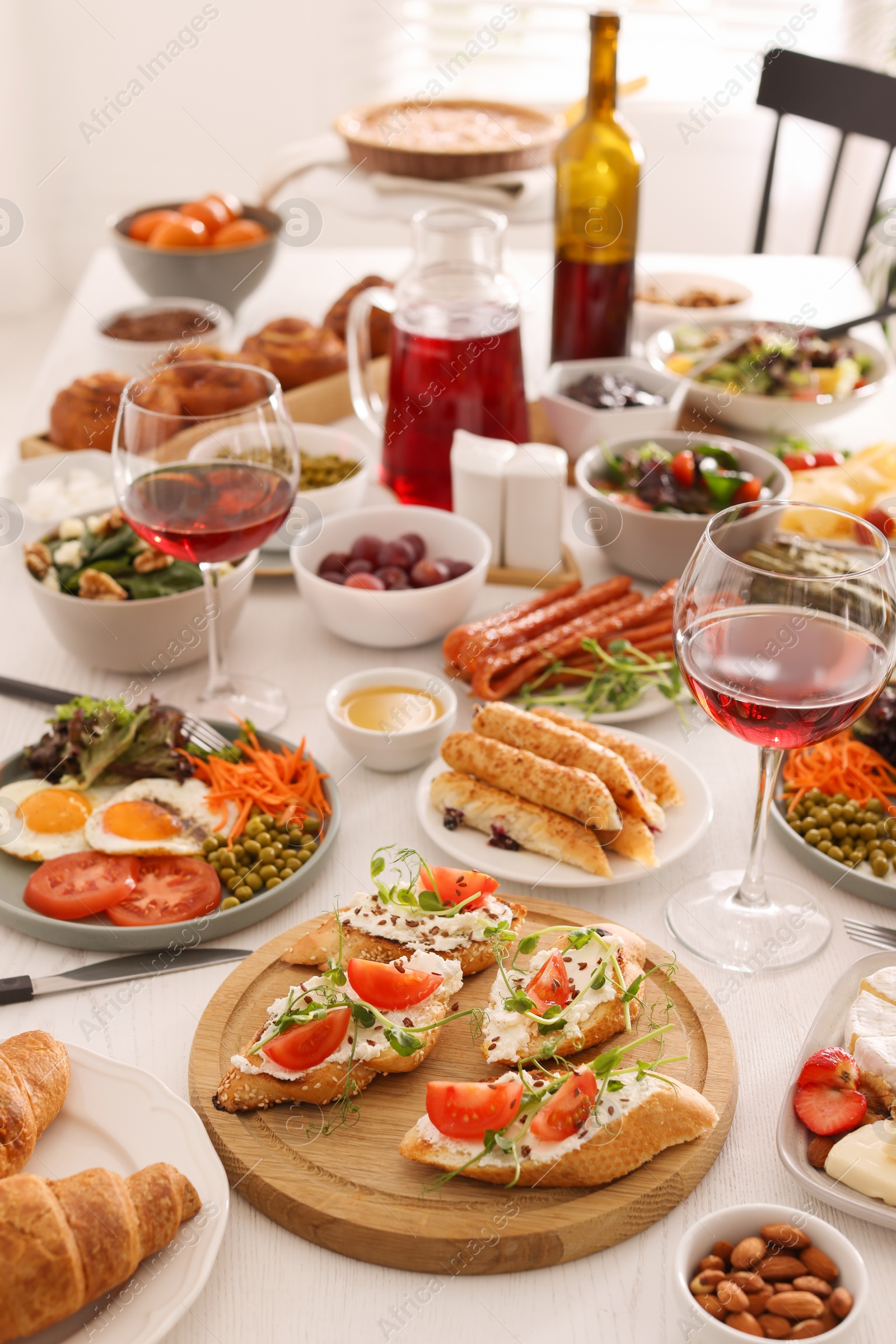 Photo of Many different dishes served on buffet table for brunch