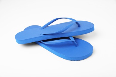 Stylish blue flip flops on white background