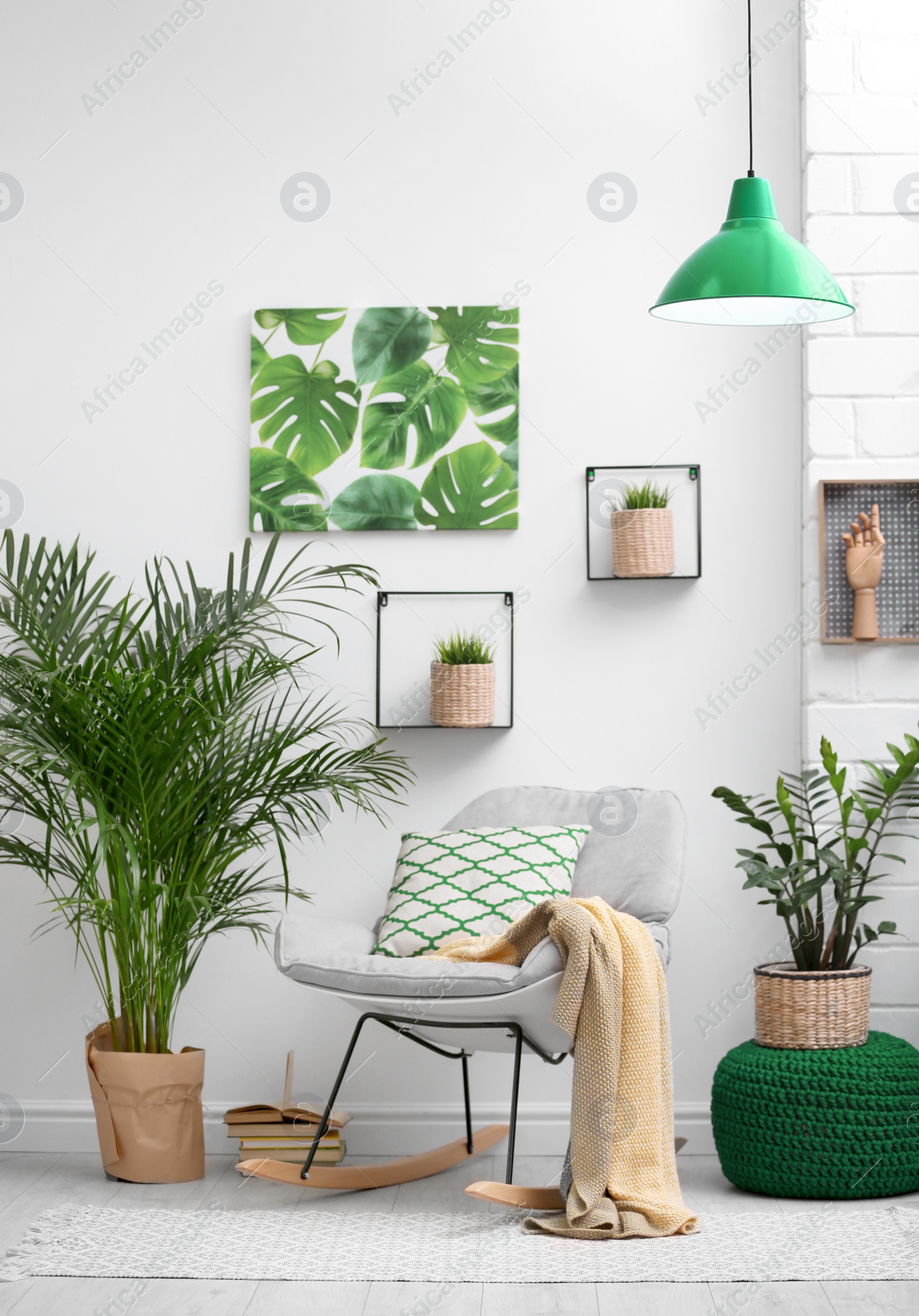 Photo of Stylish modern room interior with exotic houseplants