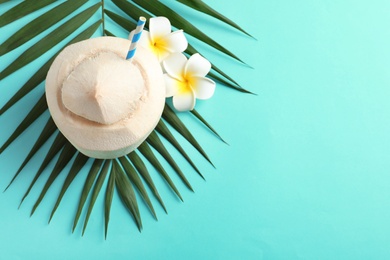 Photo of Composition with fresh coconut drink in nut on color background