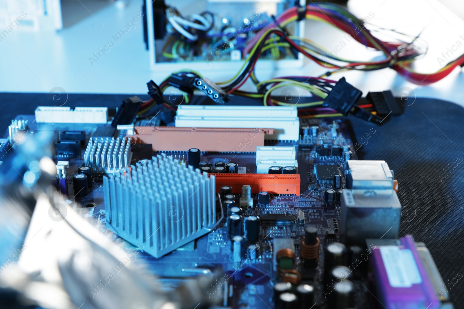 Photo of Motherboard on table, closeup. Computer repair service