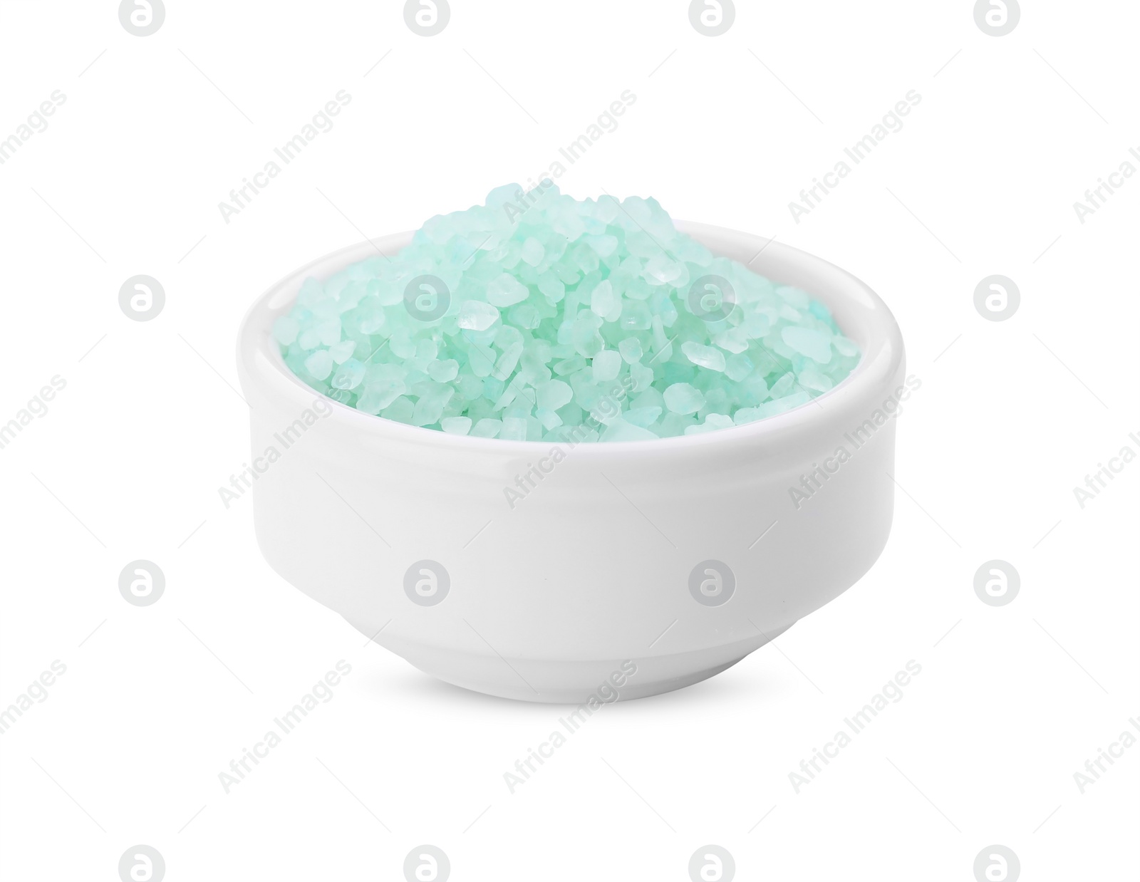 Photo of Bowl with turquoise sea salt isolated on white