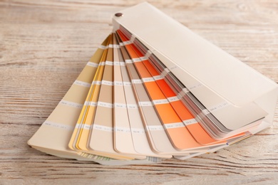 Photo of Color palette samples on wooden background