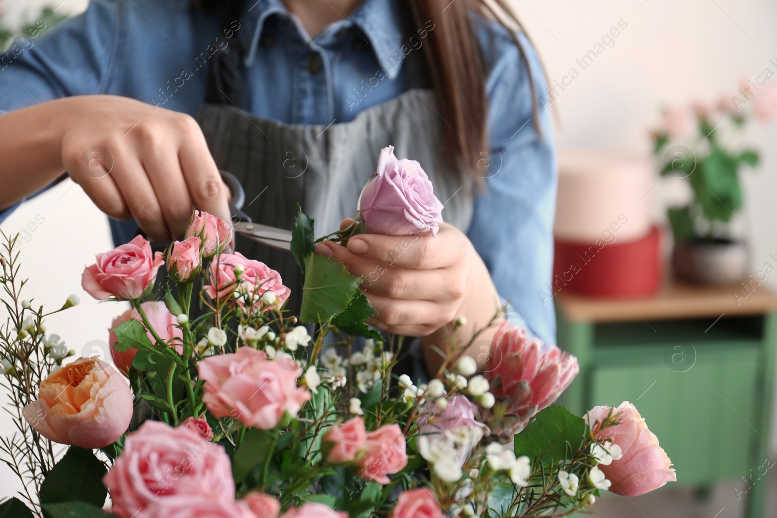 Photo of Female florist pruning flower, closeup