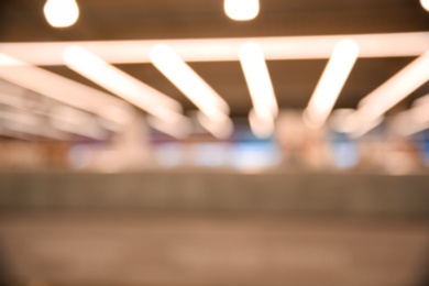 Blurred view of modern shopping mall interior