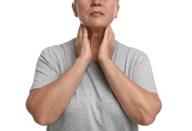 Photo of Mature woman doing thyroid self examination on white background, closeup