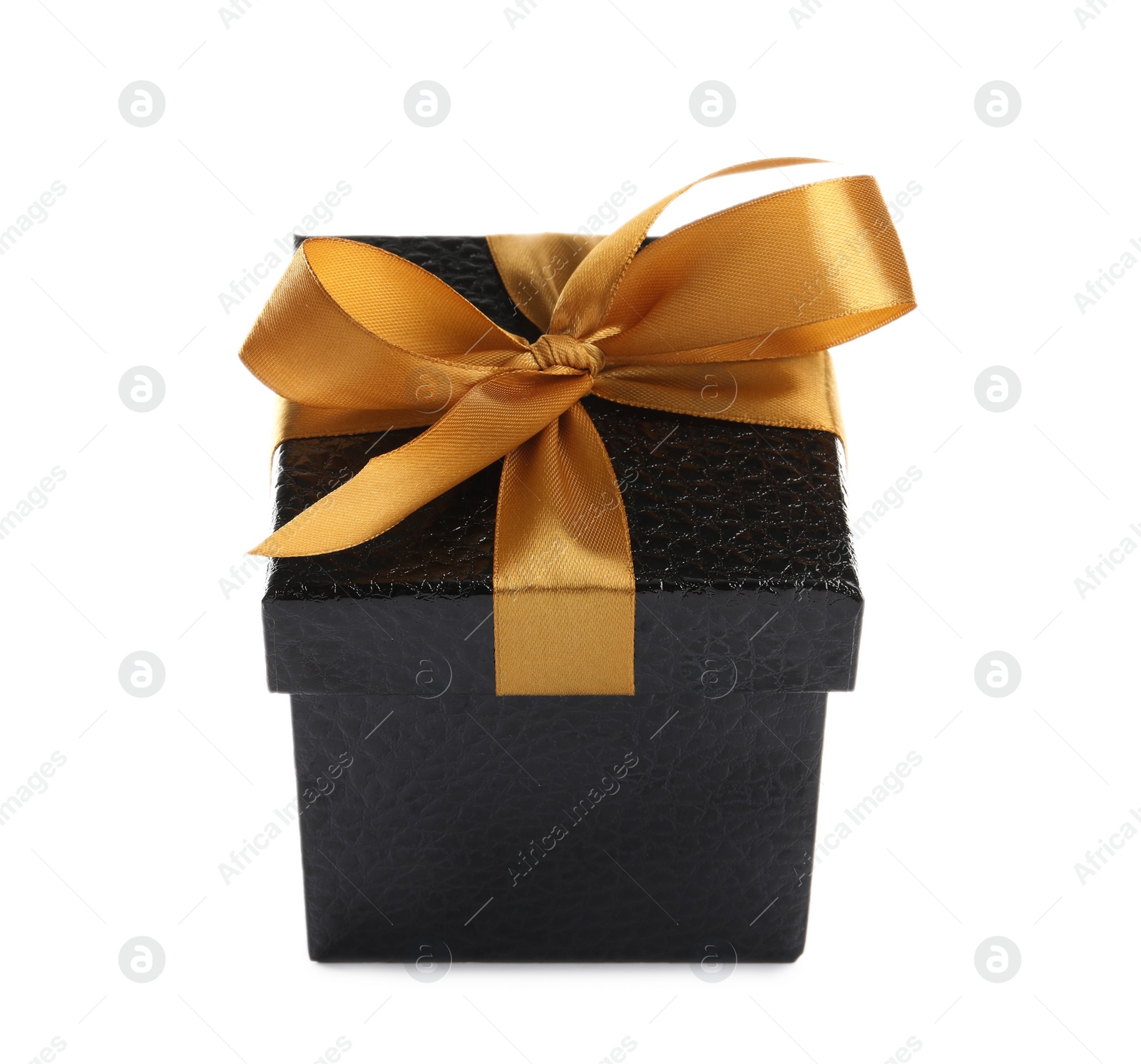 Photo of Beautiful black gift box with golden bow on white background