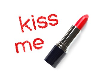 Image of Red lipstick and phrase Kiss Me on white background, top view