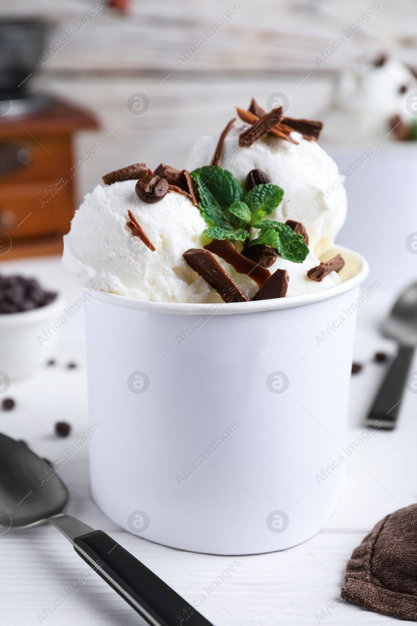 Photo of Yummy ice cream with chocolate served on white table