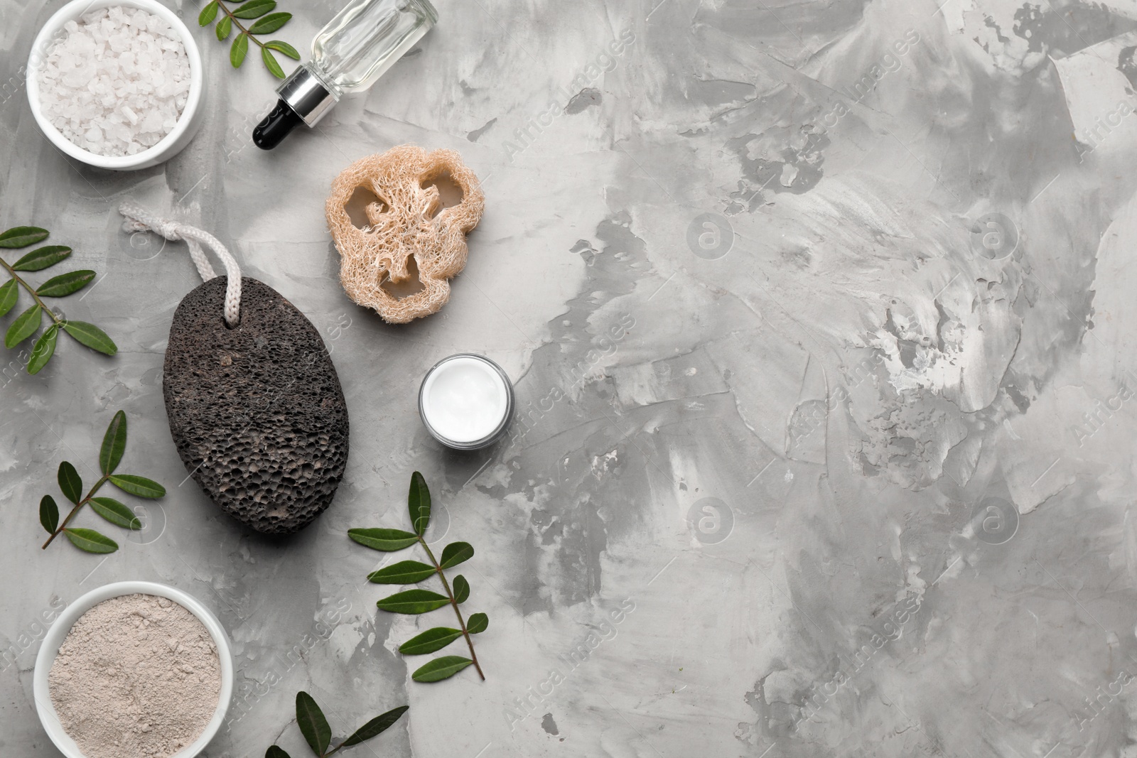 Photo of Flat lay composition with pumice stone on grey background. Space for text