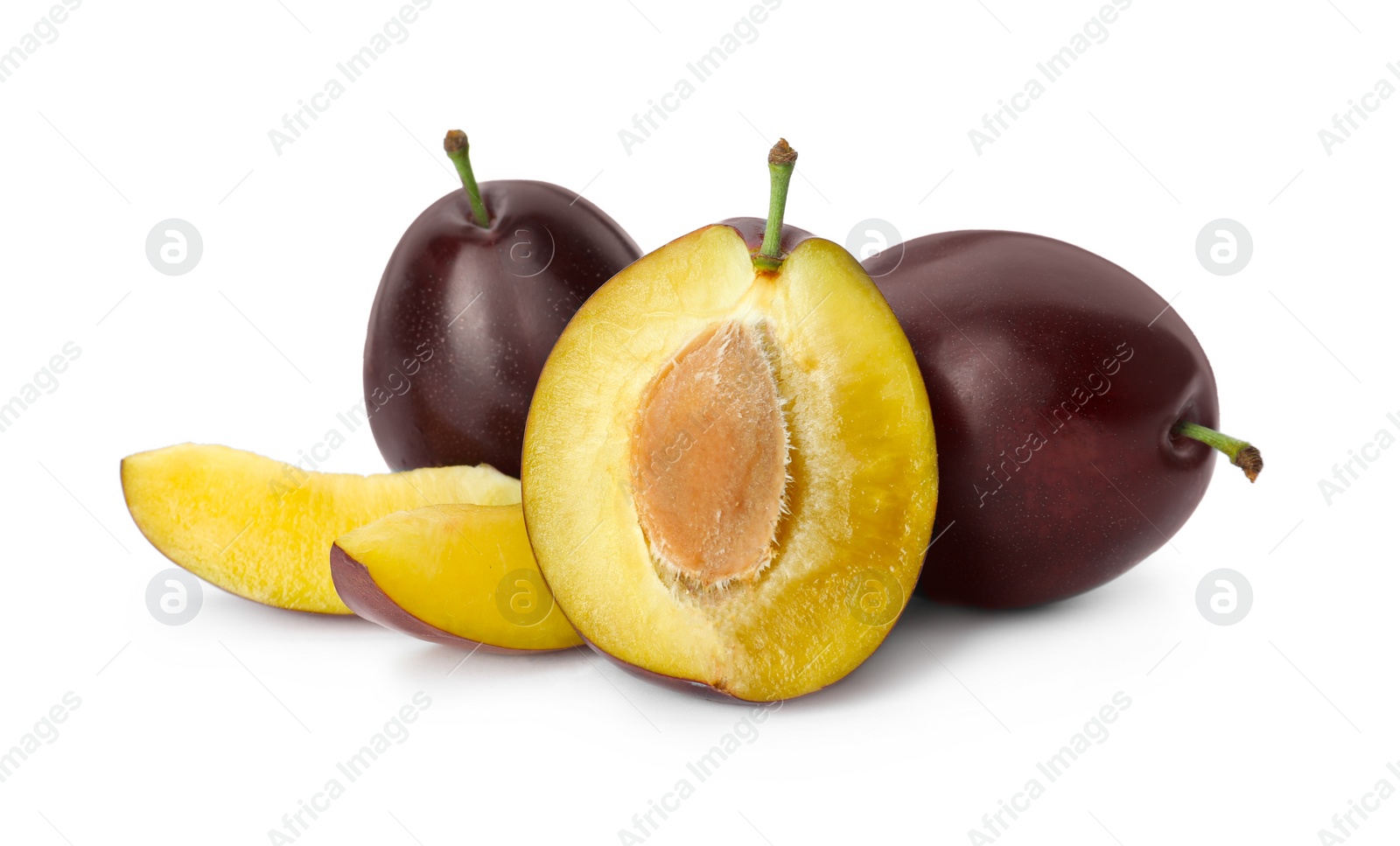 Photo of Whole and cut ripe plums on white background