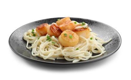 Photo of Delicious scallop pasta with green onion in plate isolated on white