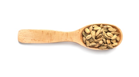 Photo of Wooden spoon with cardamom on white background. Different spices