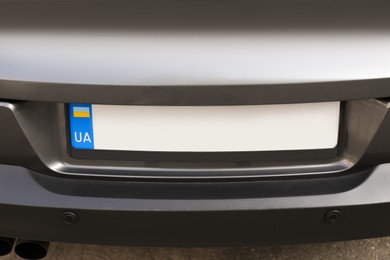 Photo of Car with vehicle registration plate outdoors, closeup