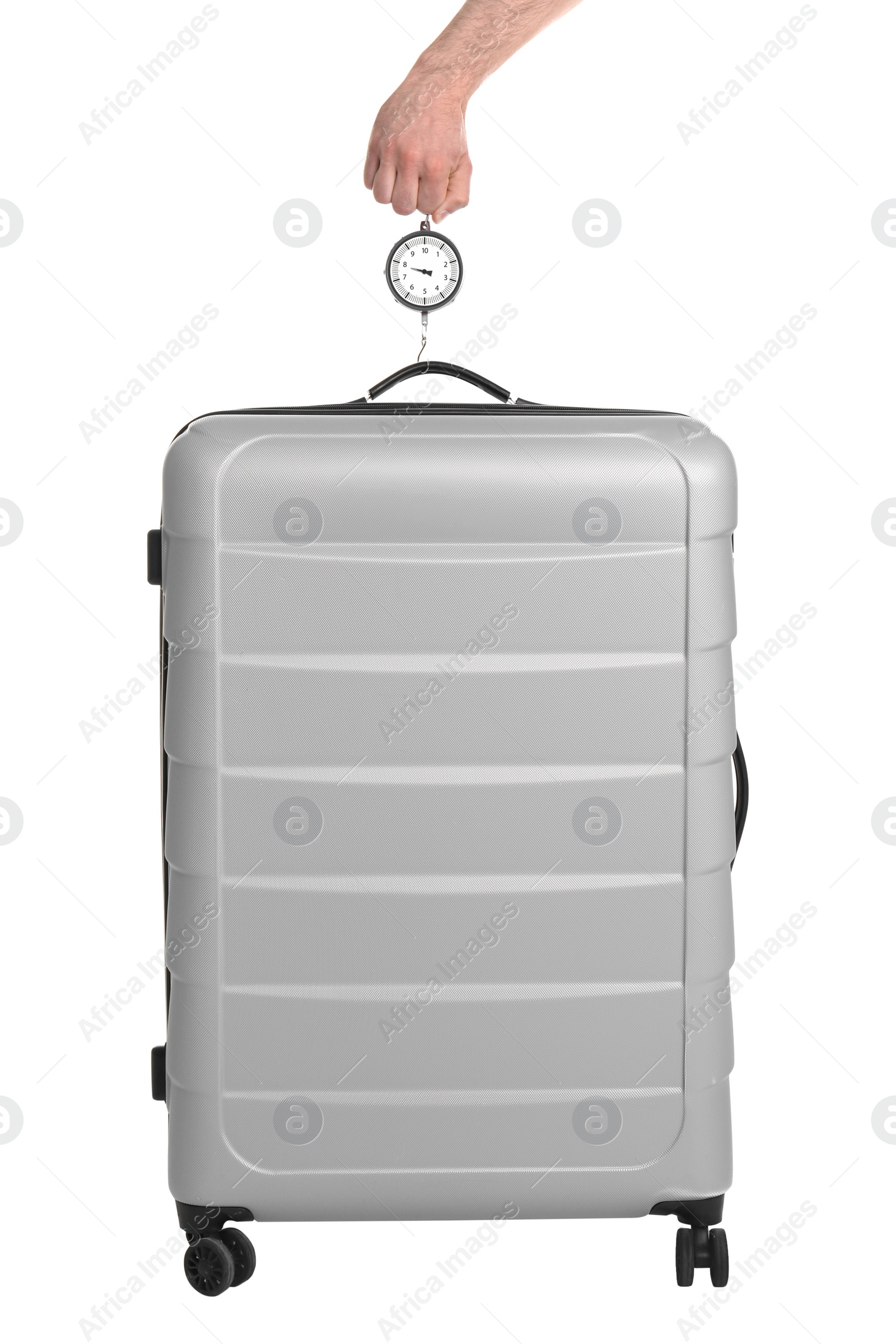 Photo of Man weighing stylish suitcase on white background