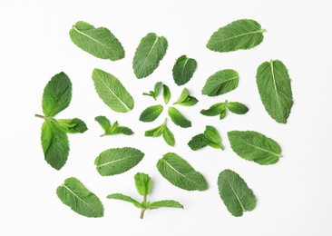 Flat lay composition with fresh green mint leaves on white background