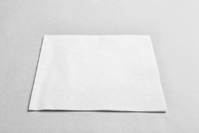 Clean napkin on grey background. Personal hygiene