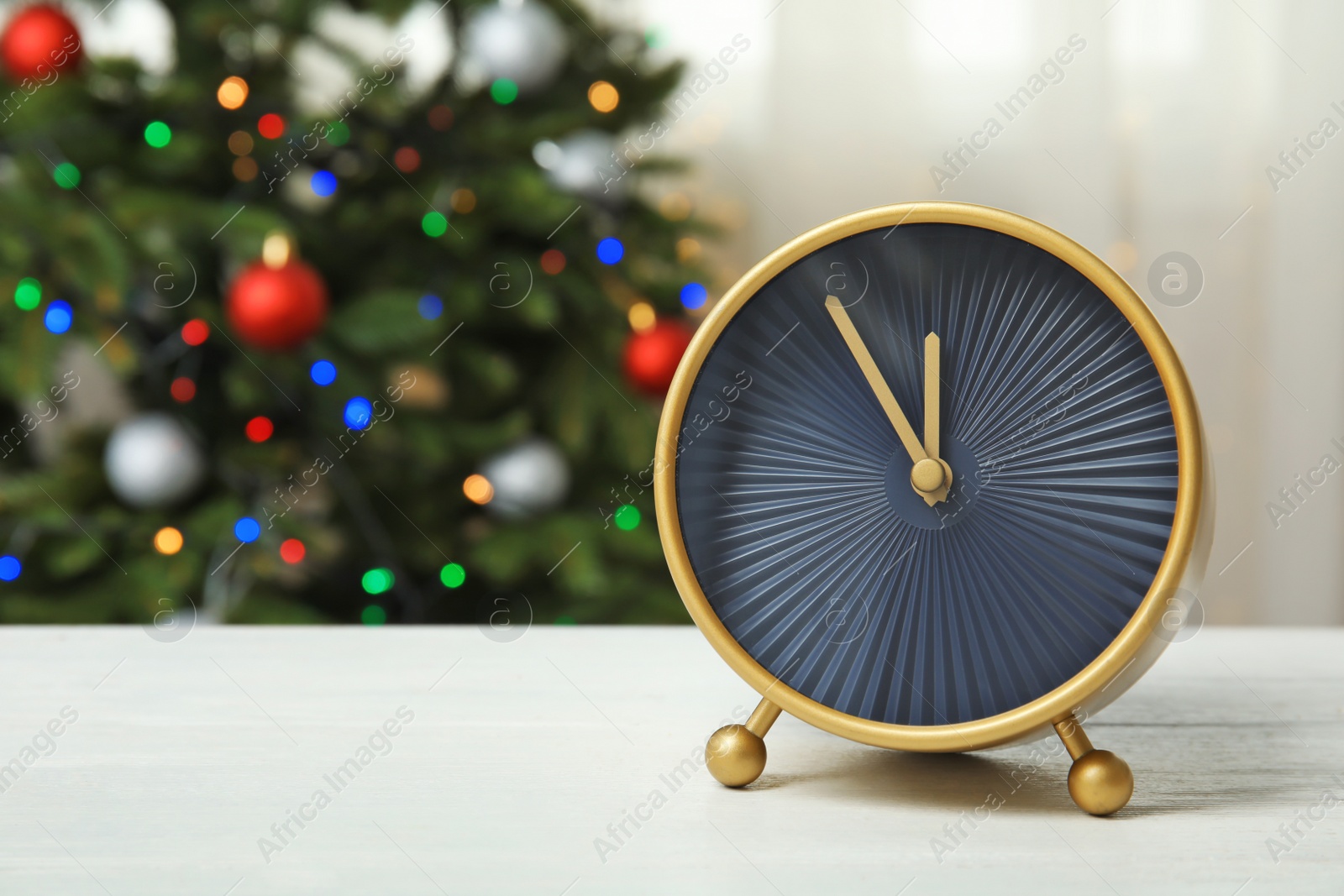 Photo of Beautiful clock on table. Christmas countdown