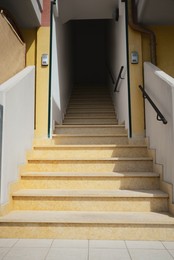 Stairs leading to entrance of house outdoors