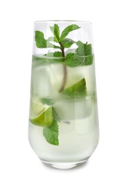 Glass of refreshing drink with lime slices and mint on white background
