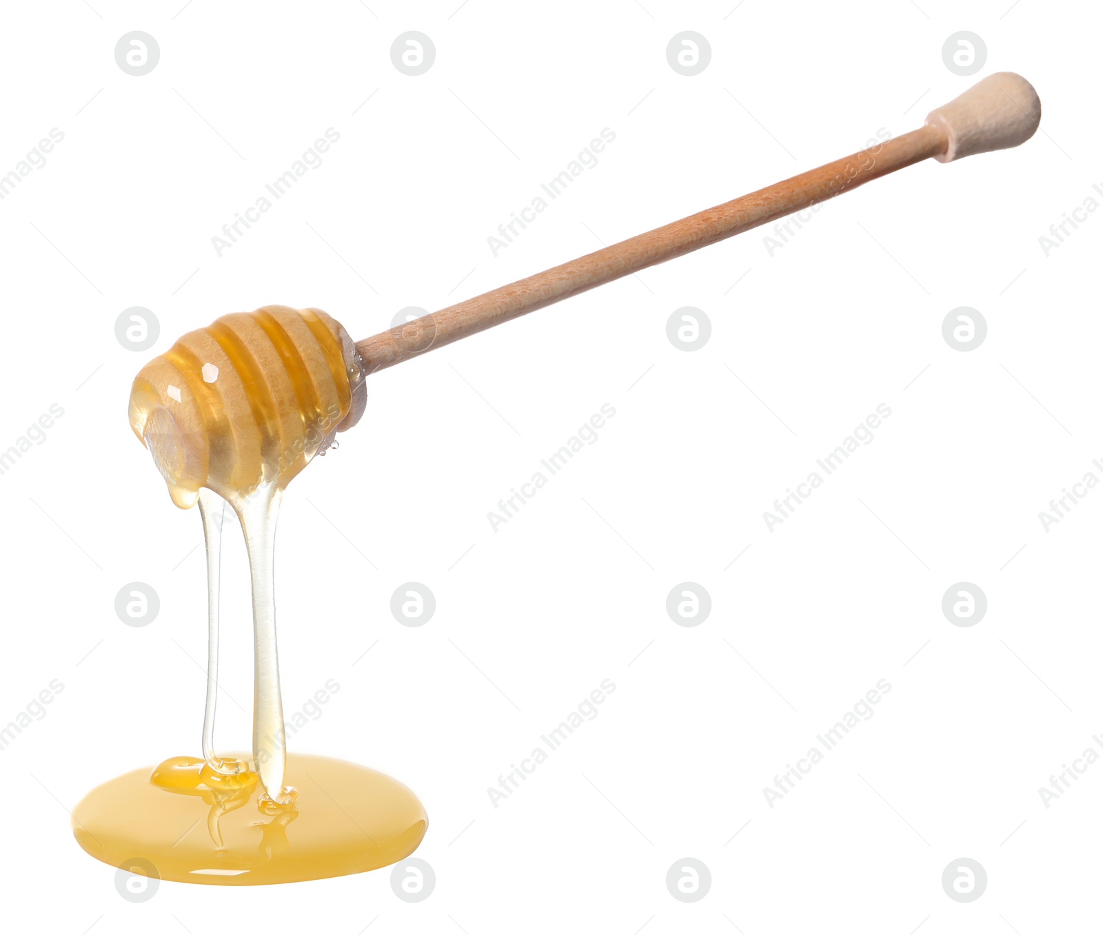 Photo of Natural honey dripping from dipper on white background