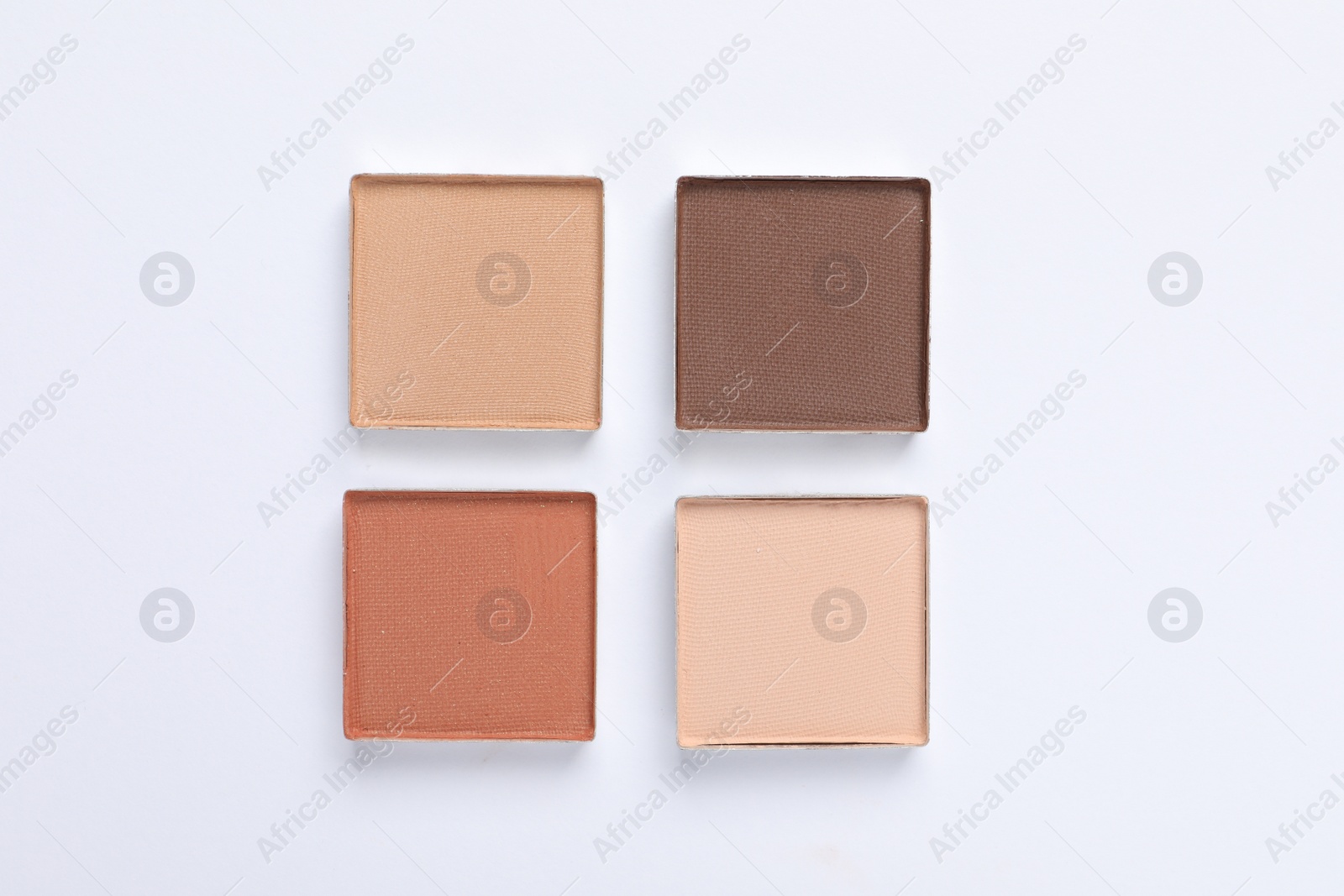 Photo of Beautiful eye shadow refill pans on white background, flat lay