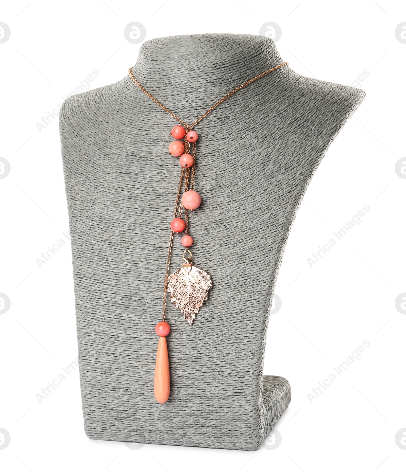 Photo of Stylish necklace with gemstones on jewelry bust against white background