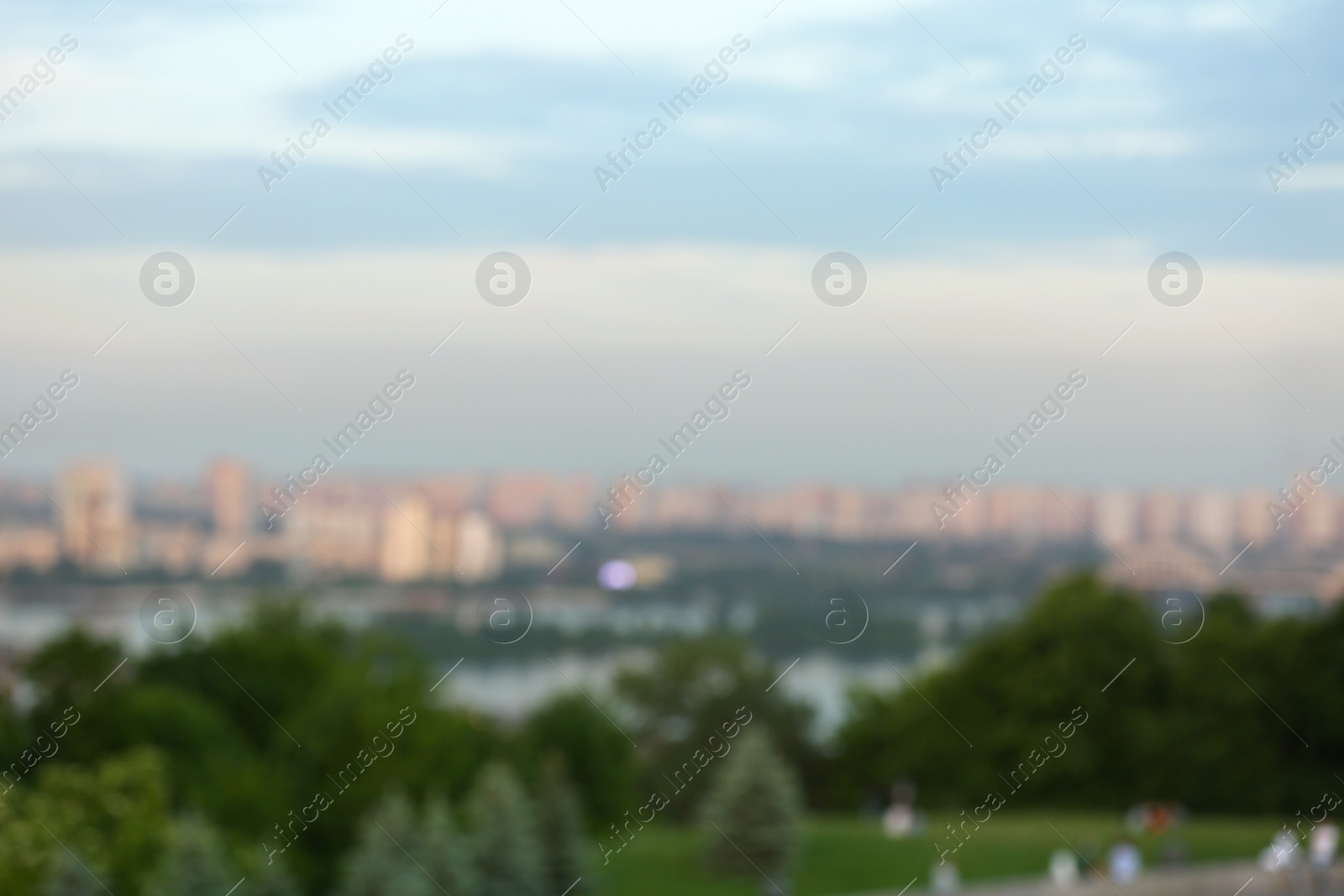 Photo of Beautiful modern city on riverbank, bokeh effect