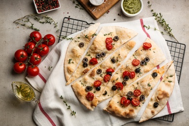 Photo of Flat lay composition with focaccia bread on light grey table