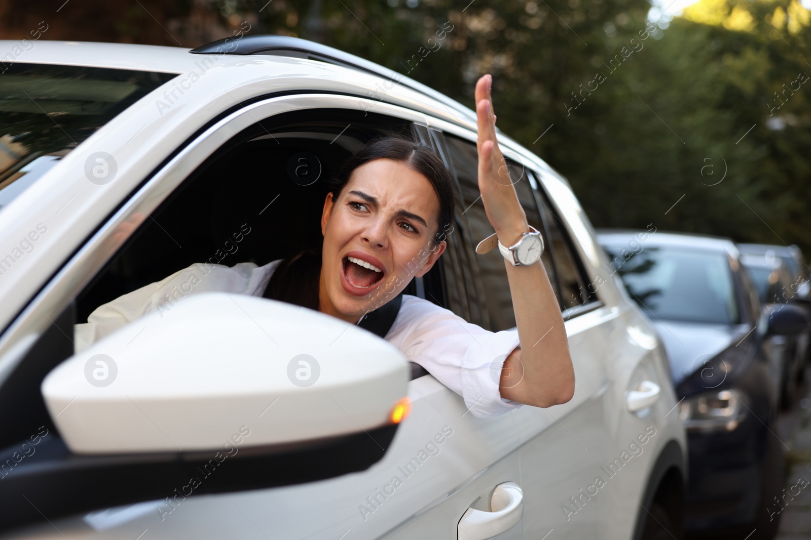 Photo of Angry driver screaming at someone from car in traffic jam