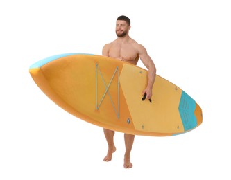 Handsome man with orange SUP board on white background