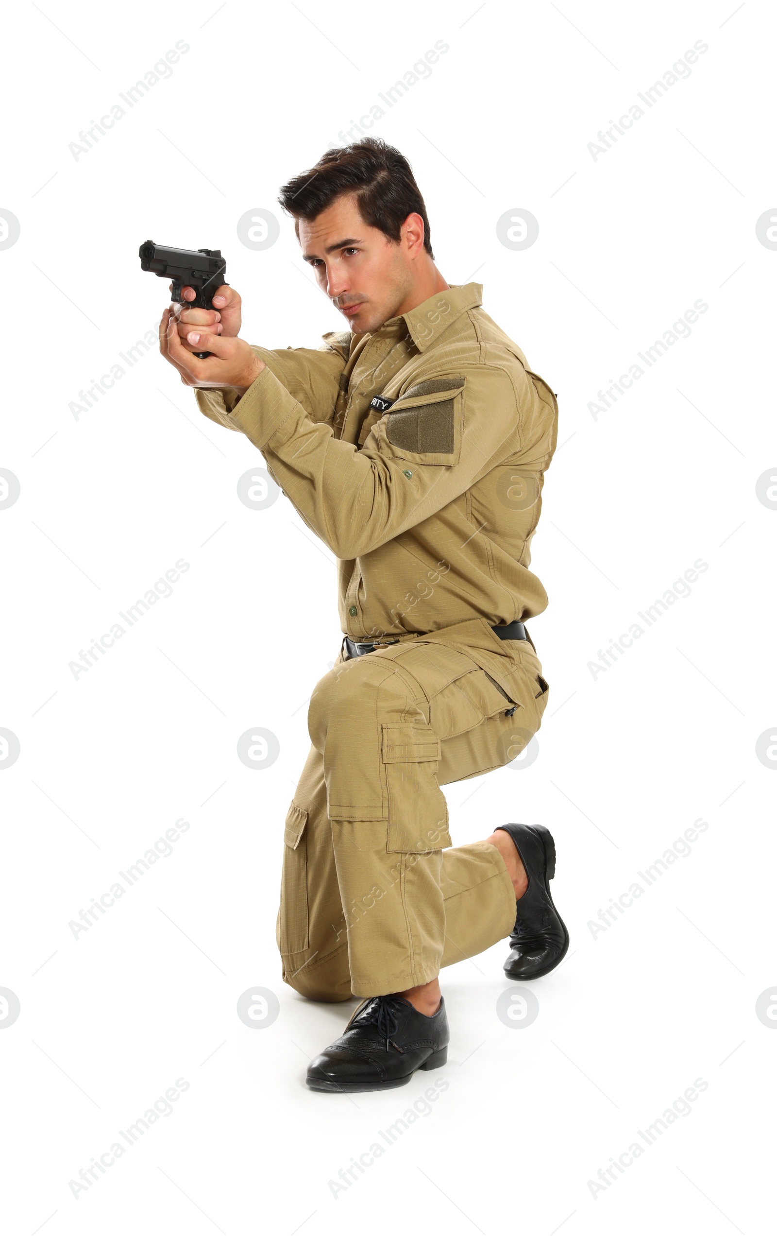 Photo of Male security guard in uniform with gun on white background