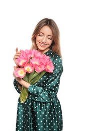 Portrait of smiling young girl with beautiful tulips on white background. International Women's Day