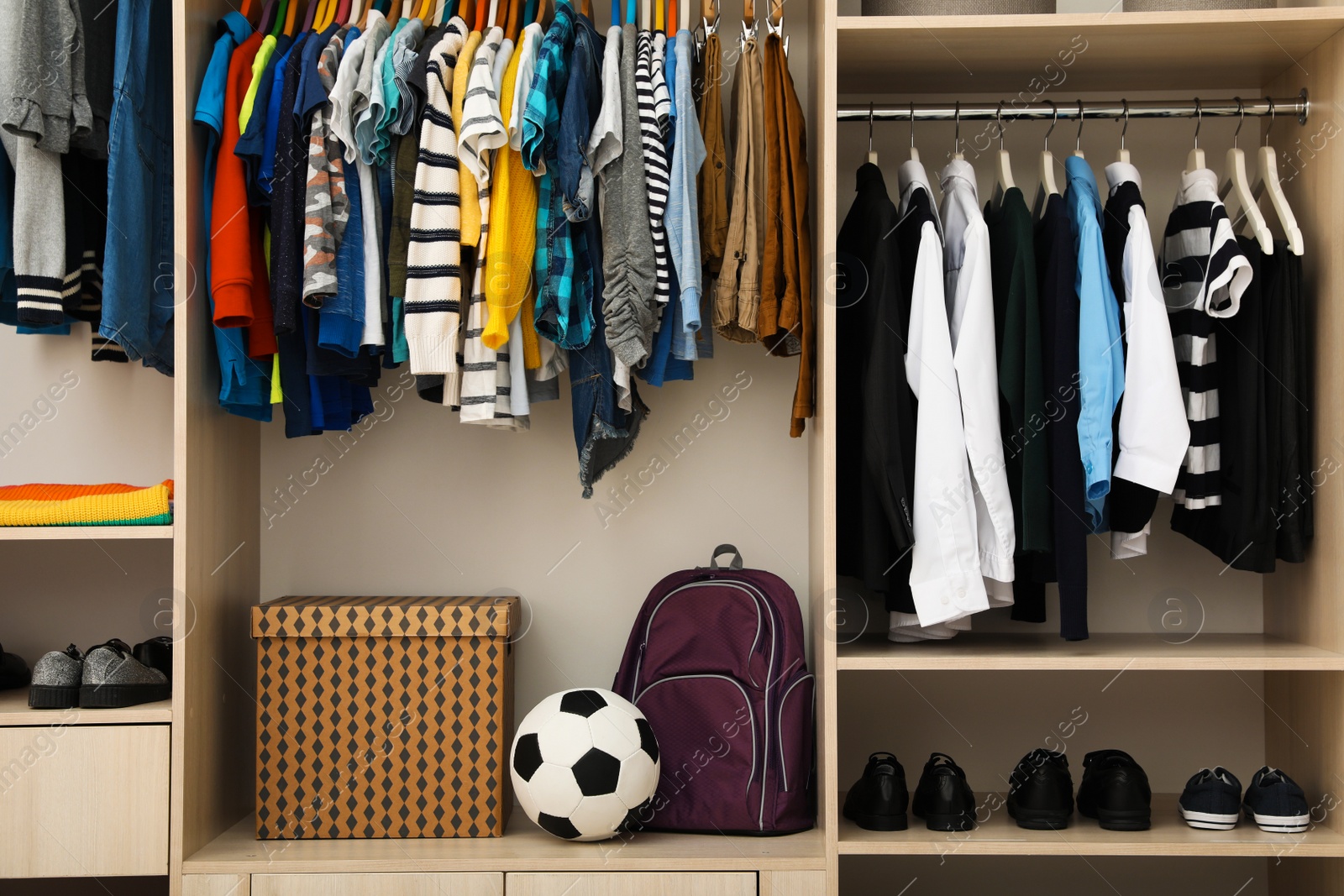 Photo of Large wardrobe with teenager clothes, shoes and accessories