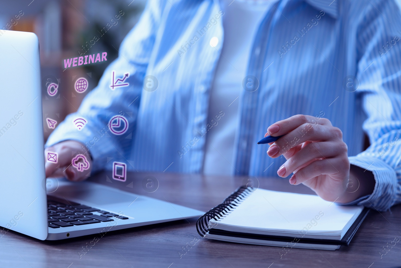 Image of Webinar. Woman using laptop and virtual screen at table, closeup