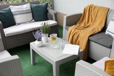 Comfortable furniture with beautiful decor on outdoor terrace