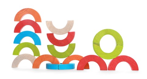 Photo of Colorful wooden pieces of play set isolated on white. Educational toy for motor skills development