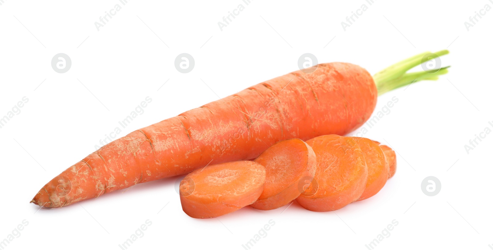 Photo of Whole and sliced ripe carrots on white background