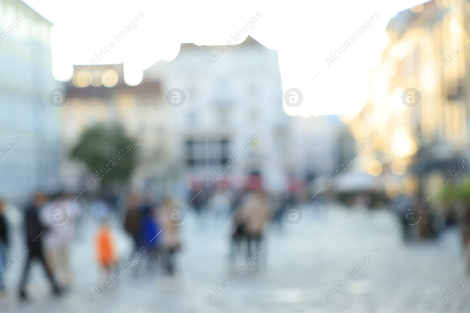 Photo of Blurred view of people walking on city street