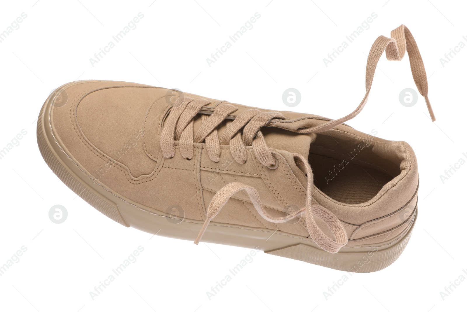 Photo of One stylish beige sneaker isolated on white