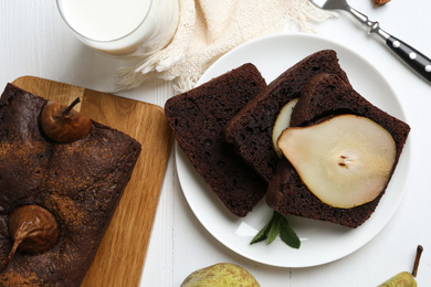 Photo of Flat lay composition with tasty pear bread on white wooden table. Homemade cake