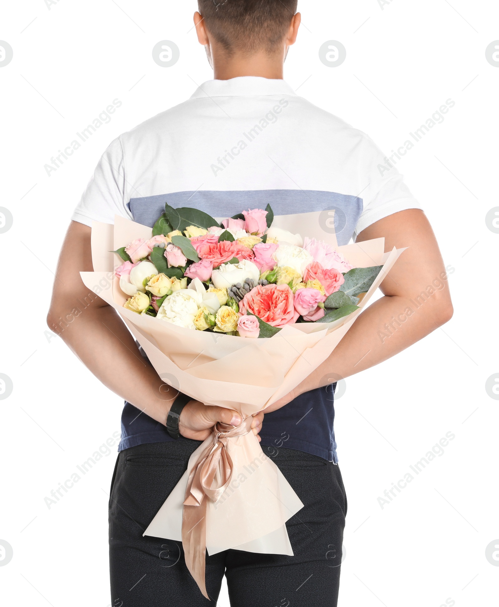 Photo of Young man holding beautiful flower bouquet on white background, back view