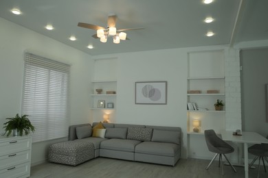 Ceiling fan, furniture and accessories in stylish living room