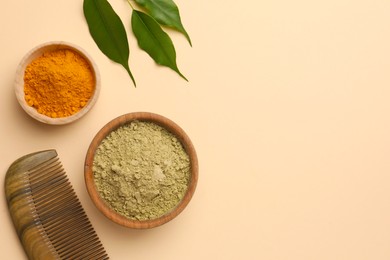 Photo of Flat lay composition with henna and turmeric powder on beige background, space for text. Natural hair coloring
