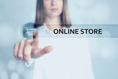 Image of Woman pointing at search bar with phrase Online Store on virtual screen, closeup